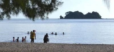 Thai People Paddling in the Sea at Hat Laem Sing Beach
